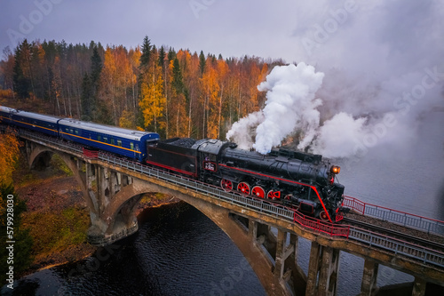 Retro train ruskeal express in karelian forests