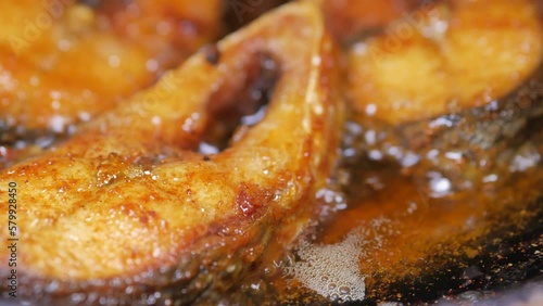 close up of cooking ilsha fish in deep oil  photo