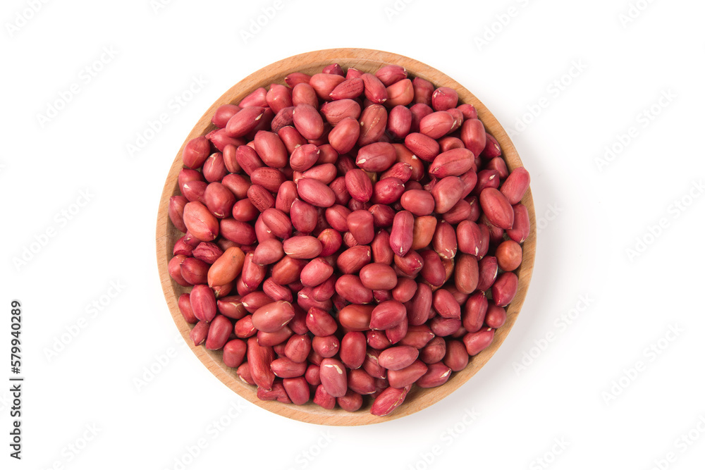 red peeled peanuts in wooden plate isolated on white background. red peeled peanuts in wooden plate isolated on white background.