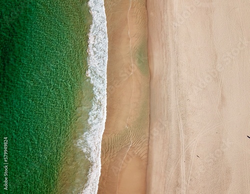 Empty beach on a sunny day with calm ocean photo