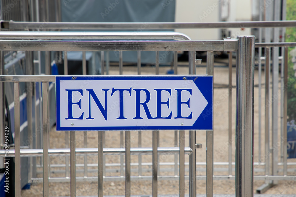 Fototapeta premium blue arrow indicate sign entree in french text white board panel means entry