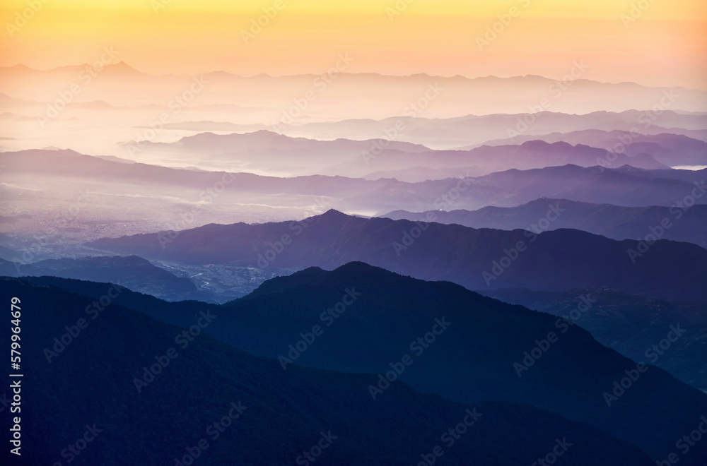 Scenic view of silhouette mountains against sky during sunrise Scenic view of silhouette mountains against sky during sunrise