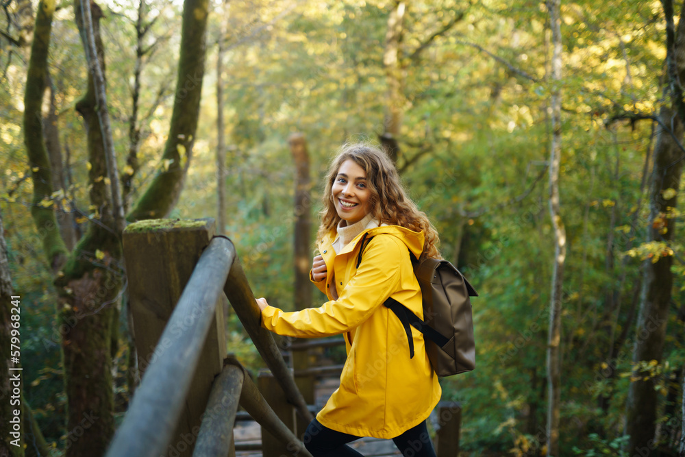 Portrait of young woman walking in the forest. Travelling, lifestyle, adventure. Portrait of young woman walking in the forest. Travelling, lifestyle, adventure.