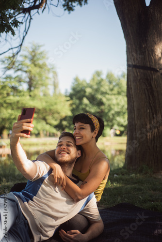 Couple taking a selfie in the park