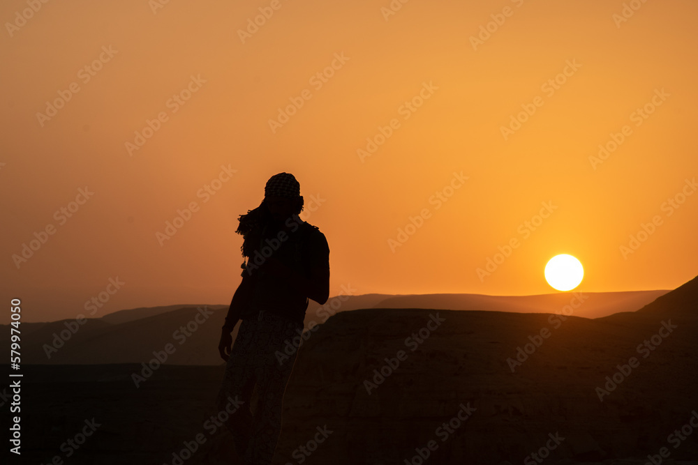 silhouette of a man in the desert