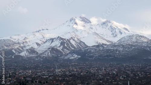 Vview of Erciyes mountain covered with snow. with Hacilar district, in Kayseri city  photo