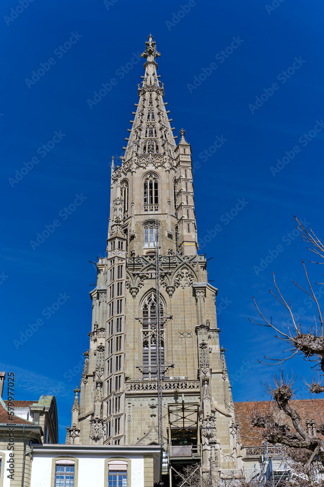 Looking up tower of Berner Münster church at the old town of City of Bern on a sunny winter day. Photo taken February 21st, 2023, Bern, Switzerland.
