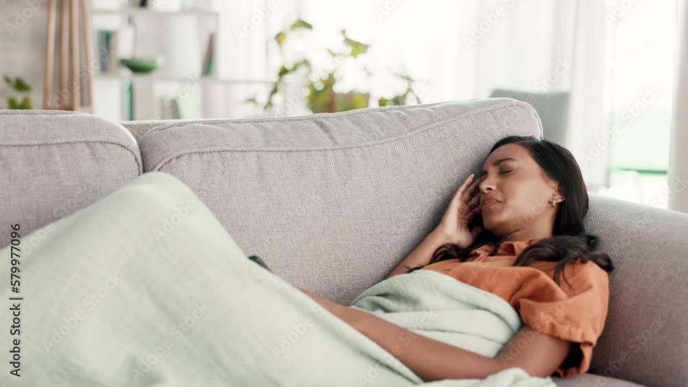 Woman with headache, lying on couch and sick, illness and pain, relax at home with migraine and problem. Indian female with head cold, smartphone and wifi, stress with fatigue and physically ill Woman with headache, lying on couch and sick, illness and pain, relax at home with migraine and problem. Indian female with head cold, smartphone and wifi, stress with fatigue and physically ill