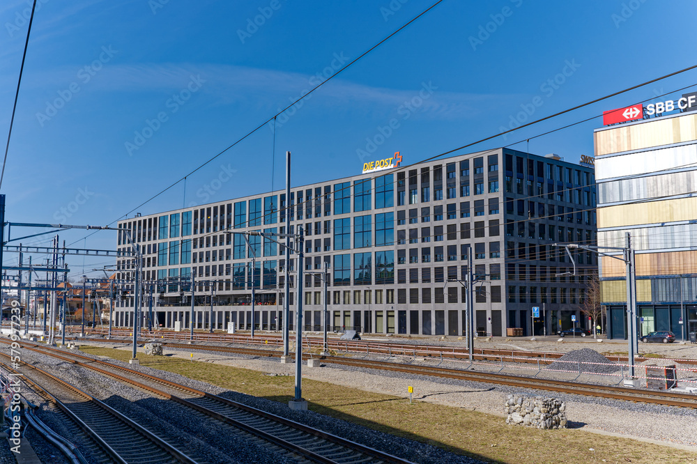 Modern office building with headquarters of Swiss Post and Swiss railway  company SBB at Swiss City of Bern on a sunny winter day. Photo taken  February 21st, 2023, Bern Wankdorf, Switzerland. Photos