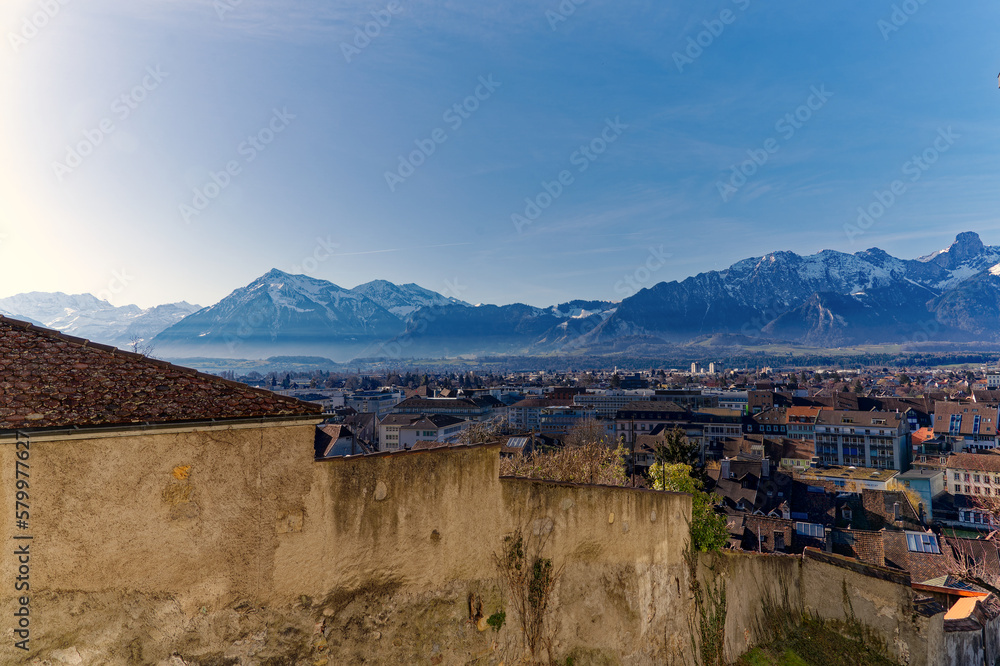 Castle hill at the old town of City of Thun with stone wall and beautiful panorama of the Swiss Alps on a sunny winter day. Photo taken February 21st, 2023, Thun, Switzerland.