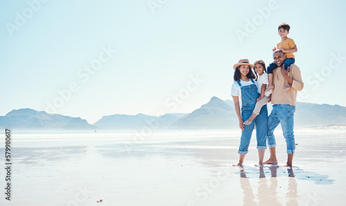 Portrait of mother, father and children at beach for bonding, quality time and relaxing on weekend. Travel mockup, family and happy parents smile with kids on summer holiday, vacation and adventure #579980617
