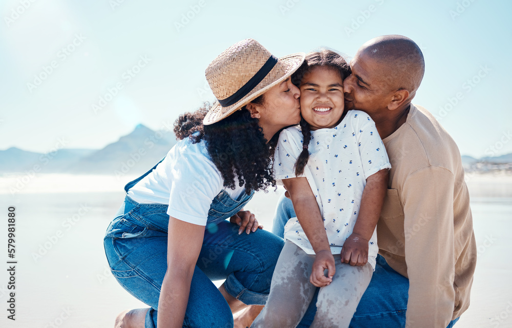 Obraz premium Black family, children and beach with parents kissing their daughter outdoor in nature on the sand by the ocean. Kids, love or summer with a mother and father giving a kiss to their female child