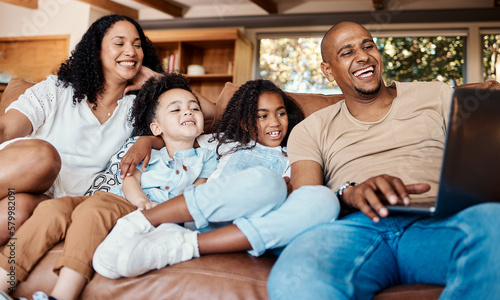 Laptop, happy family and kids with online video, movies or cartoon on couch on live streaming service, learning or bonding. Biracial mom, father and children watch film or show on computer and sofa © Anela R/peopleimages.com