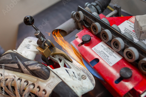 Tableau sur toile Service for skate with adept repairing skates professional sharpening hockey fir