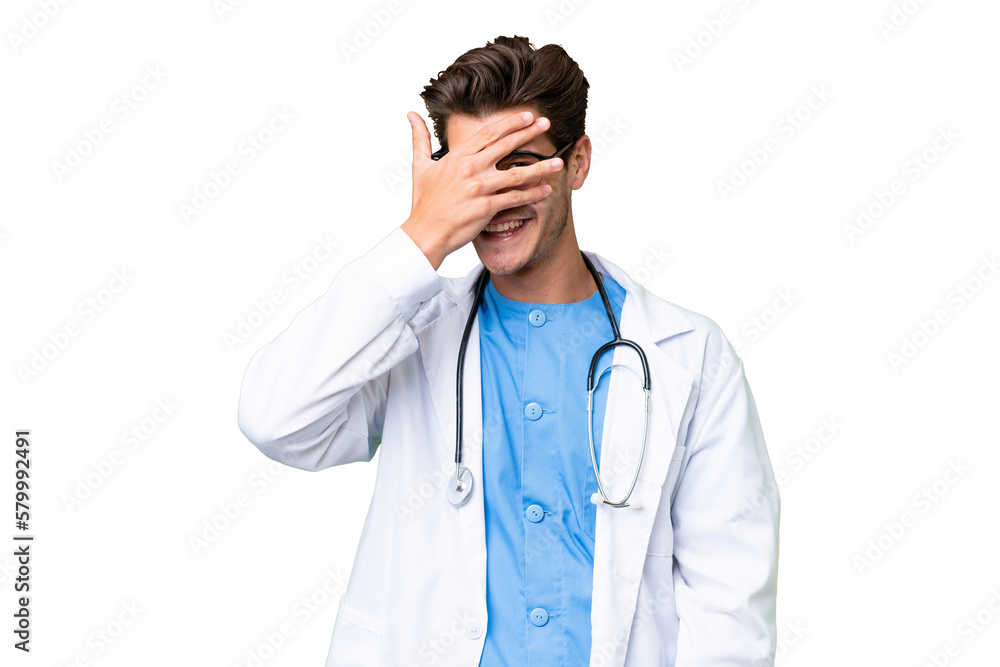 Young doctor man over isolated background covering eyes by hands and smiling