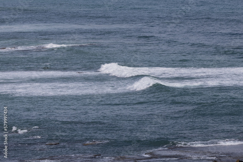 Small breaking wave in the ocean.