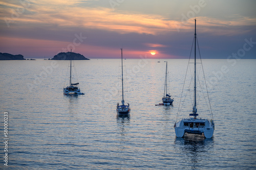 Sunset in the Mediterranean Sea, full of sailing boats and catamarans, Mallorca, Balearic Islands, Spain