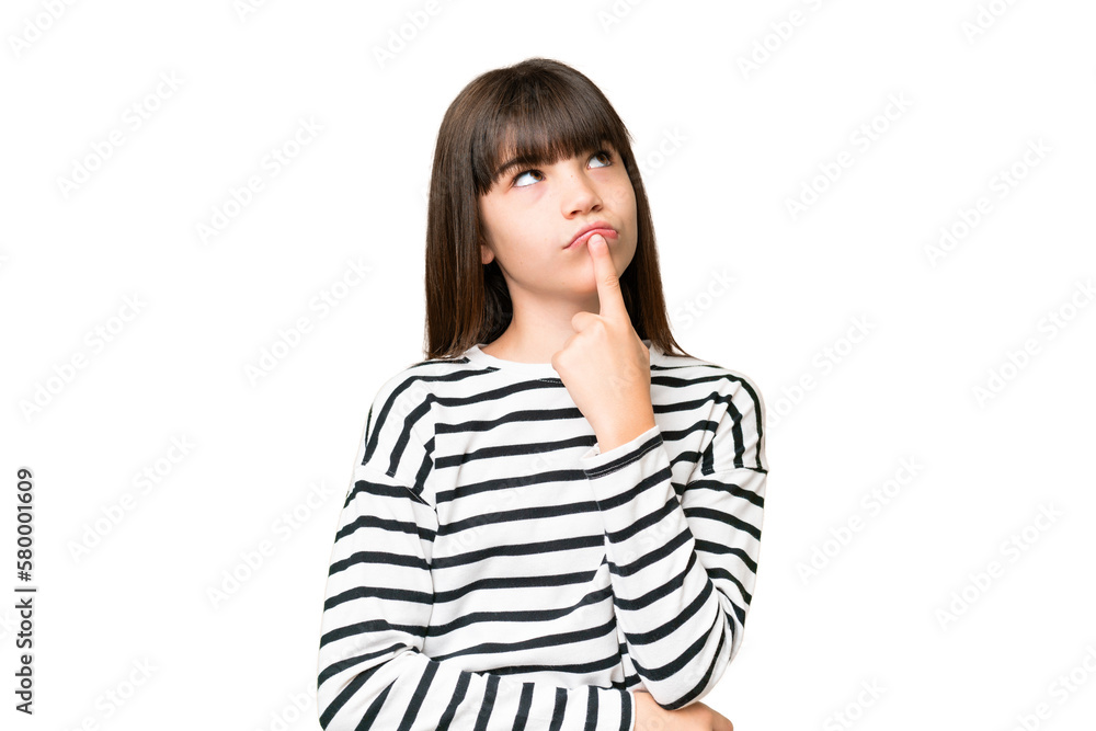 Little caucasian girl over isolated background having doubts while looking up Little caucasian girl over isolated background having doubts while looking up
