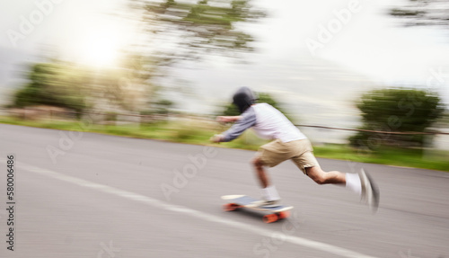 Skateboard  moving and man with motion blur for sports competition  training and exercise on street. Skating  skateboarding and male skater riding for speed  adventure and adrenaline in extreme sport