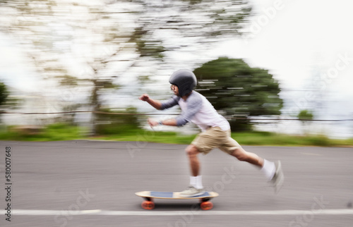 Skateboard, motion blur and man speed on road for sports competition, training and exercise in city. Skating, skateboarding and male skater ride for adrenaline, adventure and freedom for challenge