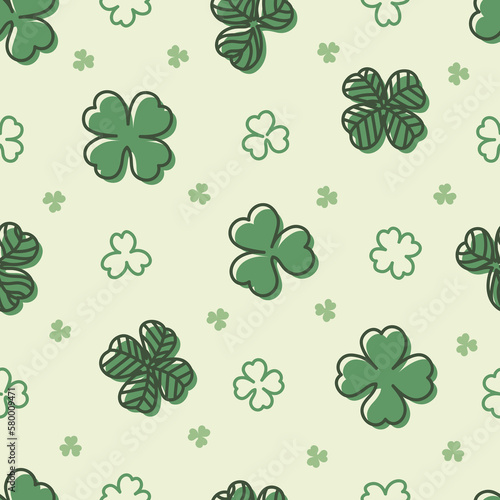 Hand drawn clover leaves seamless pattern on light green background