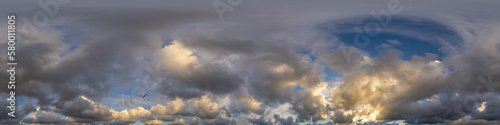 Dramatic sunset sky panorama with Cumulus clouds. Seamless hdr 360 pano in spherical equirectangular format. Complete zenith for 3D visualization, game and sky replacement for aerial drone panoramas