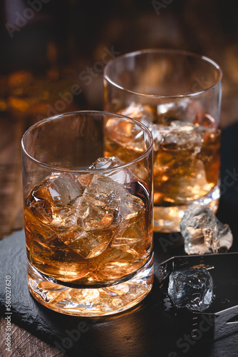 Two glasses of whiskey on ice