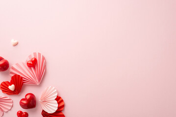 Mother's Day concept. Top view photo of pink and red origami paper hearts on isolated pastel pink background with blank space