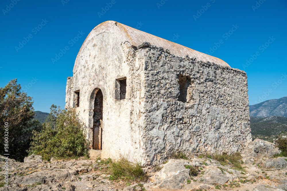 Ruined hilltop chapel at Kayakoy (Levissi) abandoned village near Fethiye in Mugla province of Turkey.