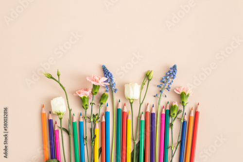 Color pencils with flowers. PANTONE peach fuzz. Color of the 2024 .. Summer school holidays concept. International children’s day background. copy space for text. 