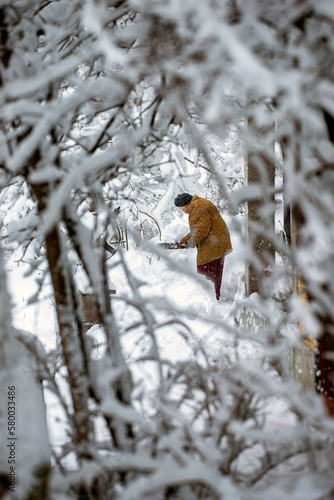 Photography women taking snow away, nacka, sweden, sverige, stockholm