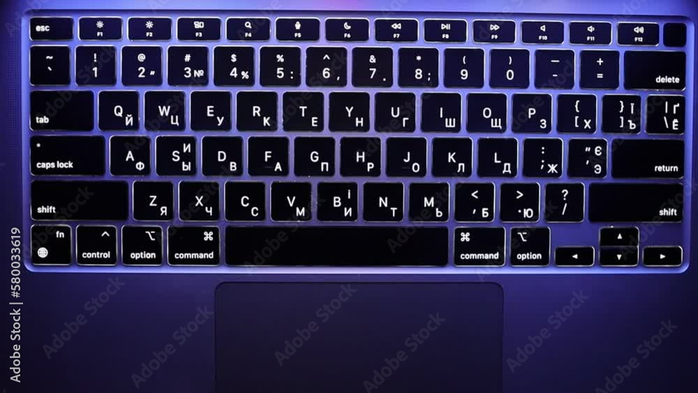 Close up laptop keyboard backlight, backlit keyboard, top view. Backlit laptop keys, top view. backlit laptop keyboard keys at night top view, soft focus, horizontal video Close up laptop keyboard backlight, backlit keyboard, top view. Backlit laptop keys, top view. backlit laptop keyboard keys at night top view, soft focus, horizontal video