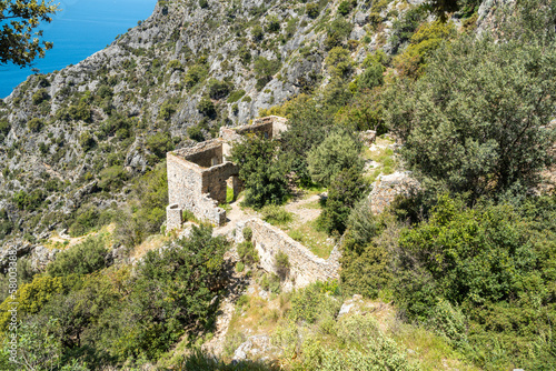 Ruins of Afkule monastery by the Mediterranean coast near Kayakoy village in Mugla province of Turkey. photo