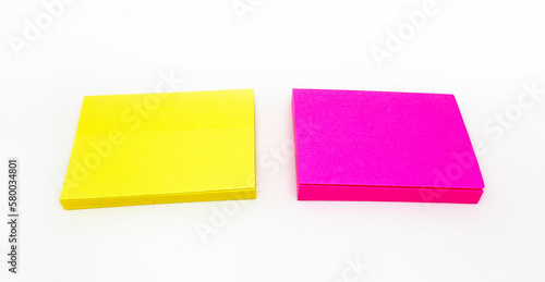 Colorful or multicolor post it isolated on white background. Yellow and pink paper for writing message, idea, notice, memo or information.