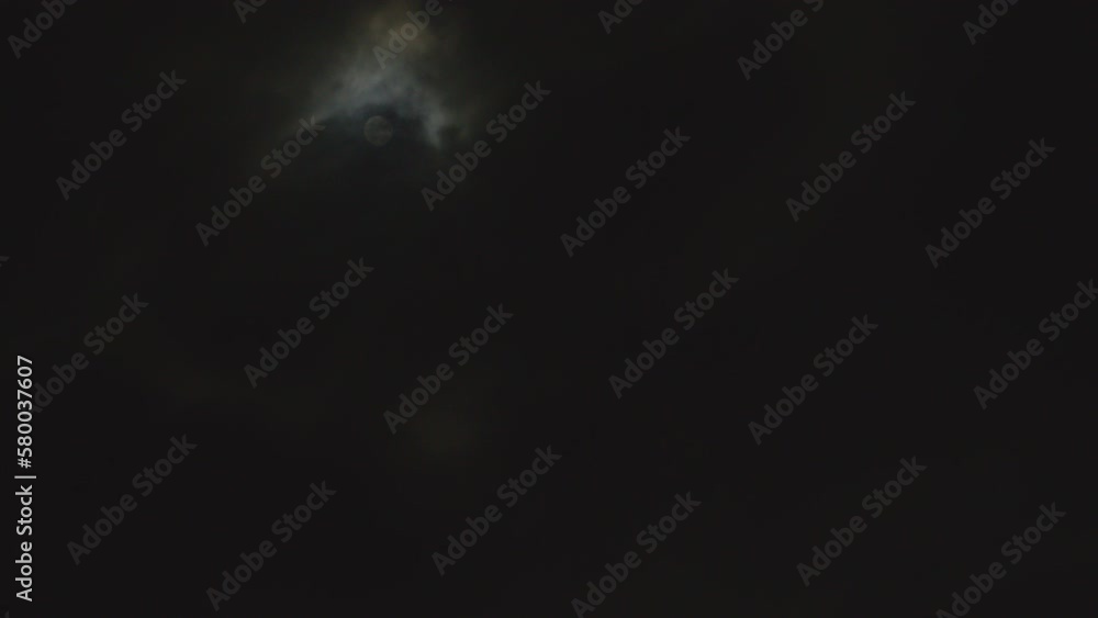 A timelapse video of a bright full moon in a cloudy night sky. A timelapse video of a bright full moon in a cloudy night sky.