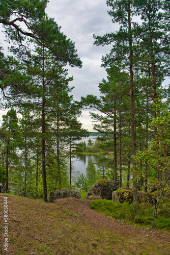 Beautiful blue lake and pine forest, Park Mon Repos, Vyborg, Russia
