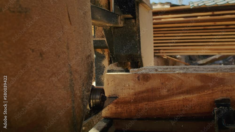 Witness the magic of the sawmill as skilled workers use their saws to transform the forest into usable wood, with close-up shots of their hands at work