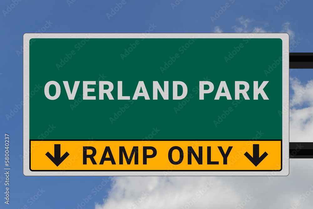 Overland Park logo. Overland Park lettering on a road sign. Signpost at entrance to Overland Park, USA. Green pointer in American style. Road sign in the United States of America. Sky in background Overland Park logo. Overland Park lettering on a road sign. Signpost at entrance to Overland Park, USA. Green pointer in American style. Road sign in the United States of America. Sky in background