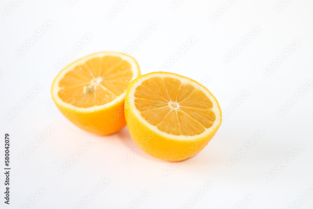 Fresh yellow lemon on a white background. Close-up photo Fresh yellow lemon on a white background. Close-up photo