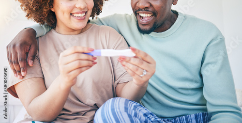 Couple, happy and pregnancy test, smile and excited for good news, positive and results in their house. Hands, woman and man with home testing kit, pregnant and fertility or ivf success while hugging