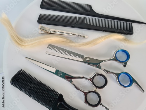 Hairdressing tool steel scissors and comb are ready to use