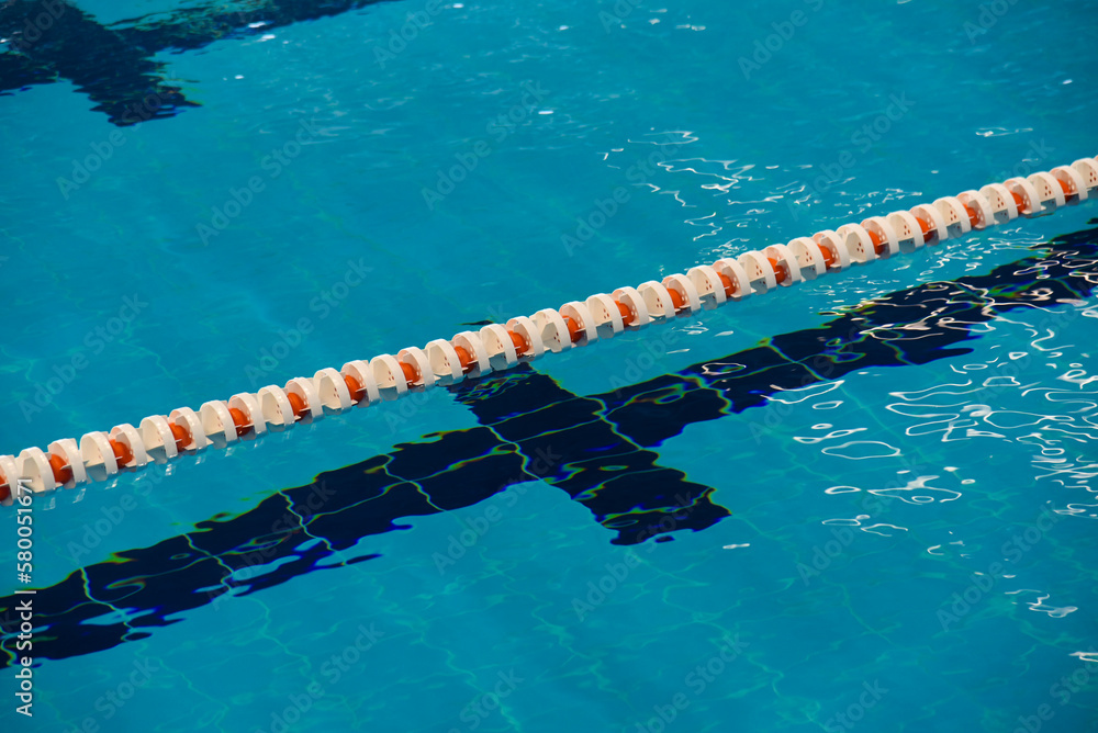 Swimming pool with dividing paths and handrails