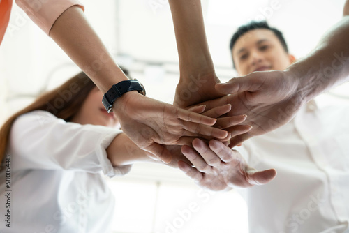 holding hands for strong teamwork and volunteer to public service action  people joined hand in hands partner agreement for great support great performance at business office background together.
