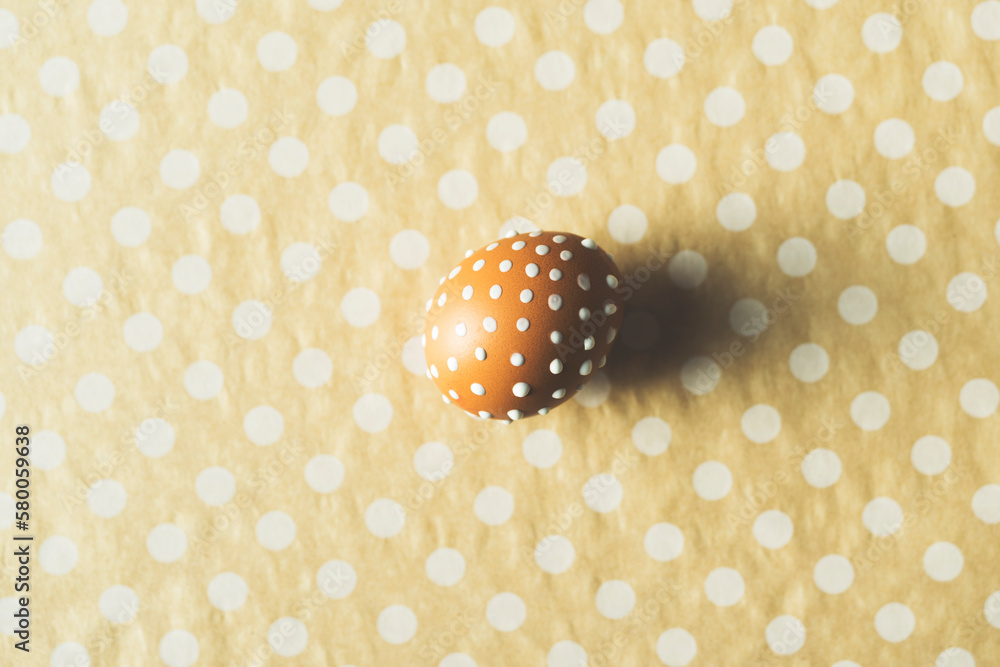 One hand painted easter eggs on dotted background One hand painted easter eggs on dotted background