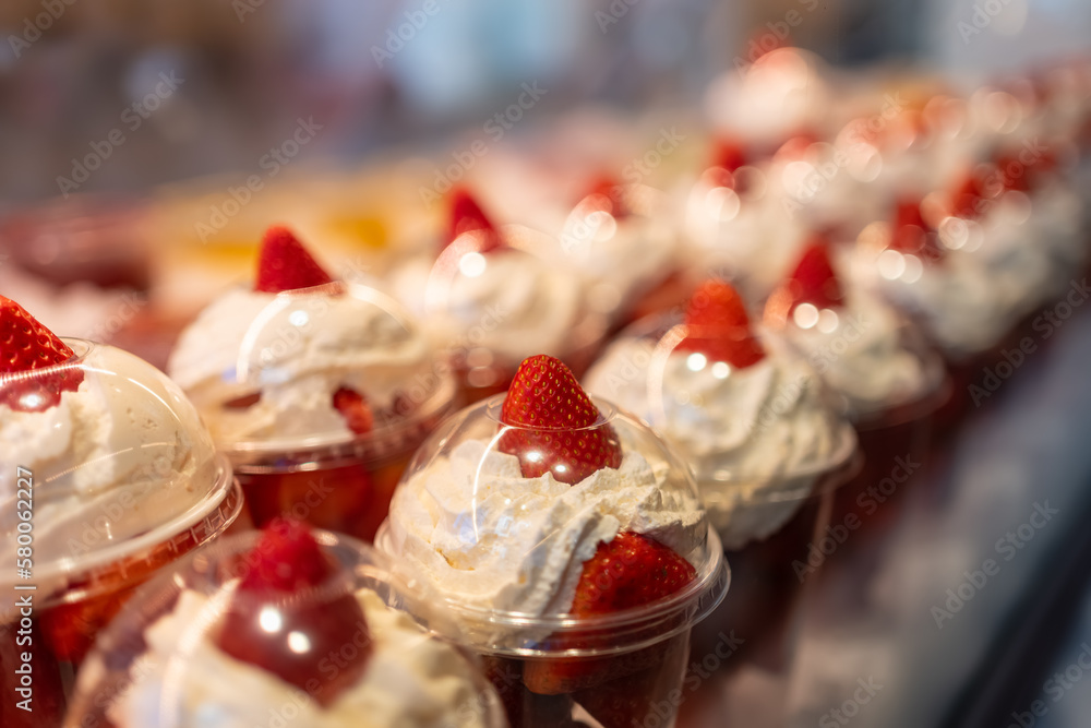 Strawberries with cream prepared in containers for individual consumption and exposed for sale, Mercado de San Miguel, Madrid. Strawberries with cream prepared in containers for individual consumption and exposed for sale, Mercado de San Miguel, Madrid.