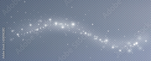 Dust sparks and stars shine with a special light. Christmas light effect. Glittering particles of magic dust.Vector sparkles on a transparent background.