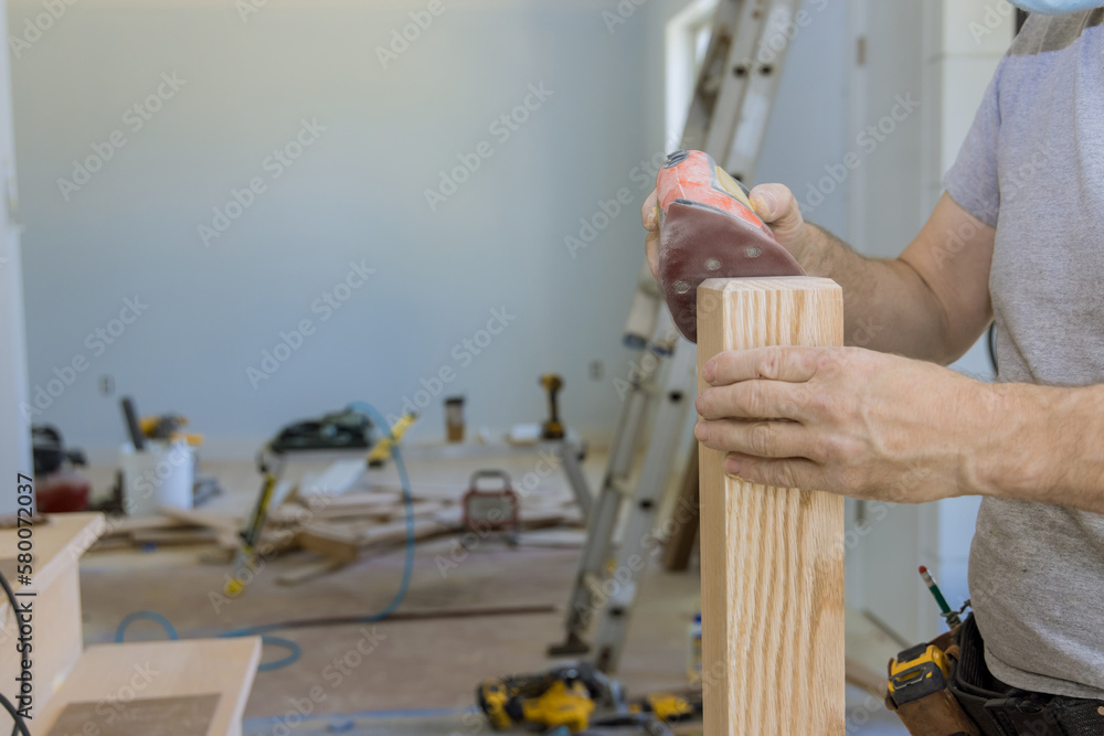It is being worked on staircase grinder work timber wood railings in new house as work progresses It is being worked on staircase grinder work timber wood railings in new house as work progresses