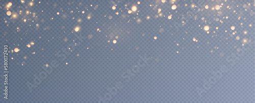 Golden sequins glow with many lights. Glittering dust. Luxurious background of golden particles.