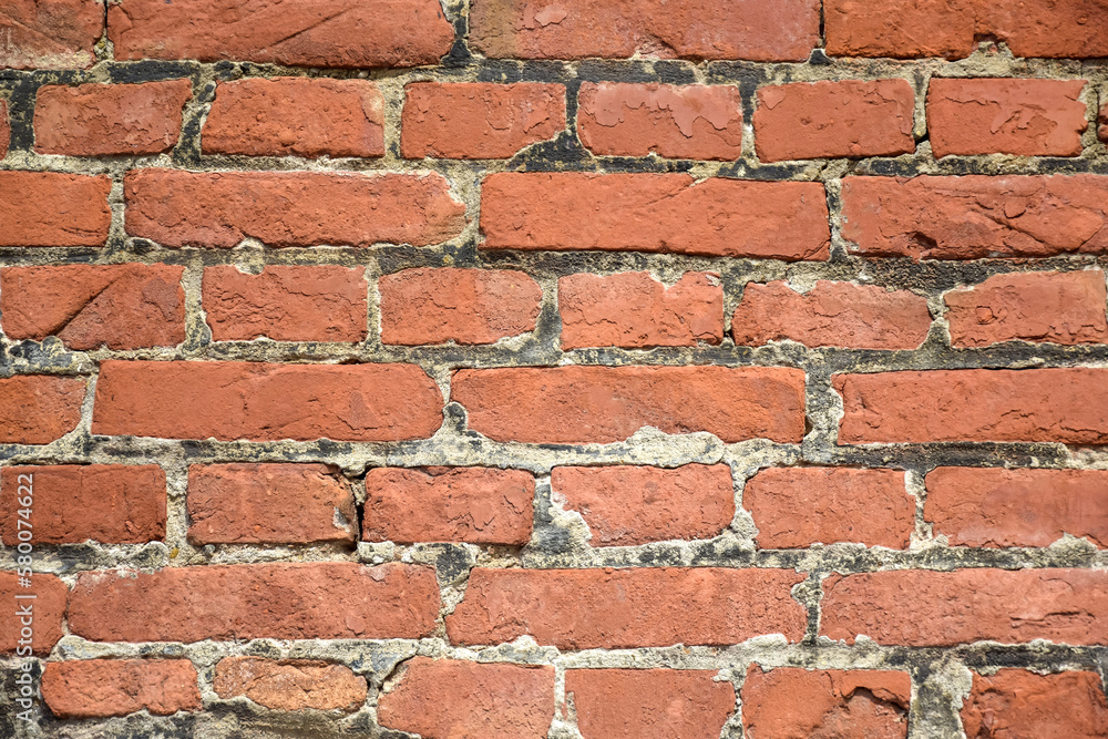 Obraz premium Red brick wall texture, abstract brickwork. Brick wall of an old building. Selective focus.
