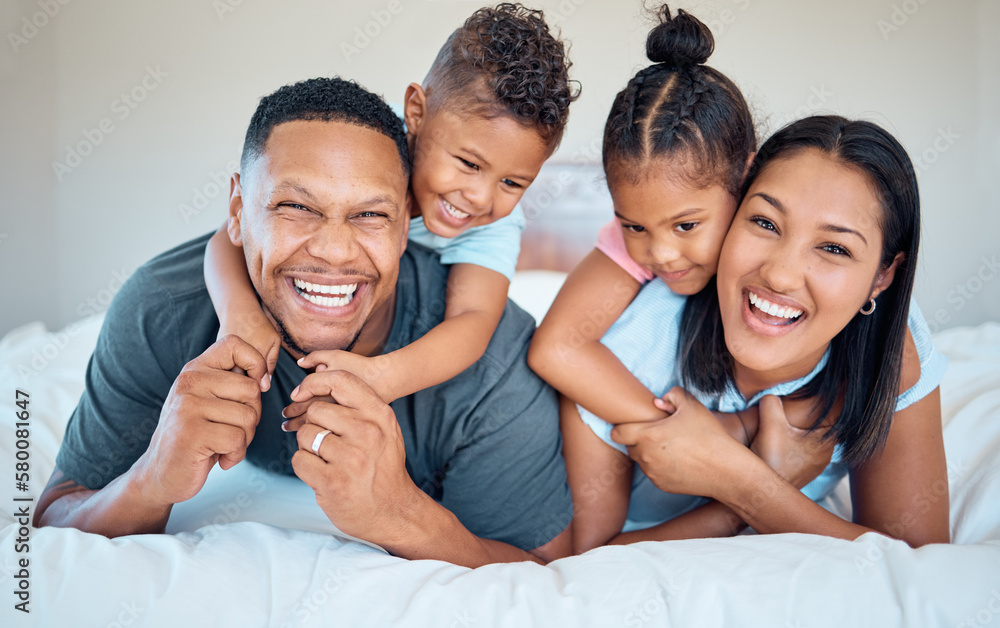 Obraz premium Happy, love and family with a smile on a bed to relax together in bedroom of their house. Happiness, father and mother laying in the room with children while bonding, relaxing and having fun at home.